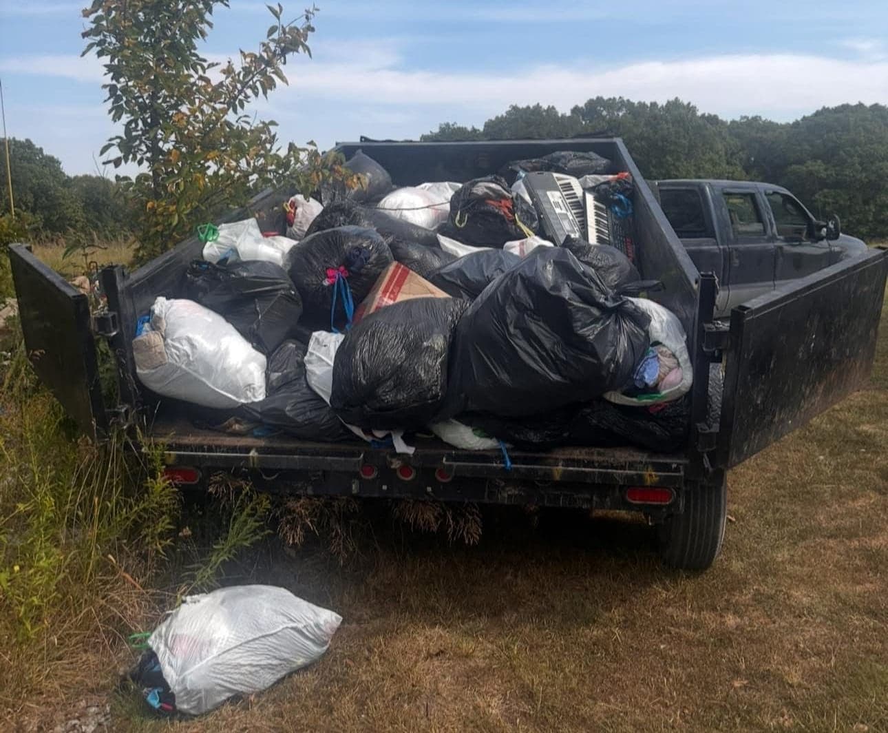 Dump trailer of bagged junk